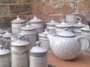 Assorted stoneware pots in speckled off-white glaze
